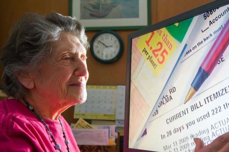 Woman looking at a computer screen with a magnified image