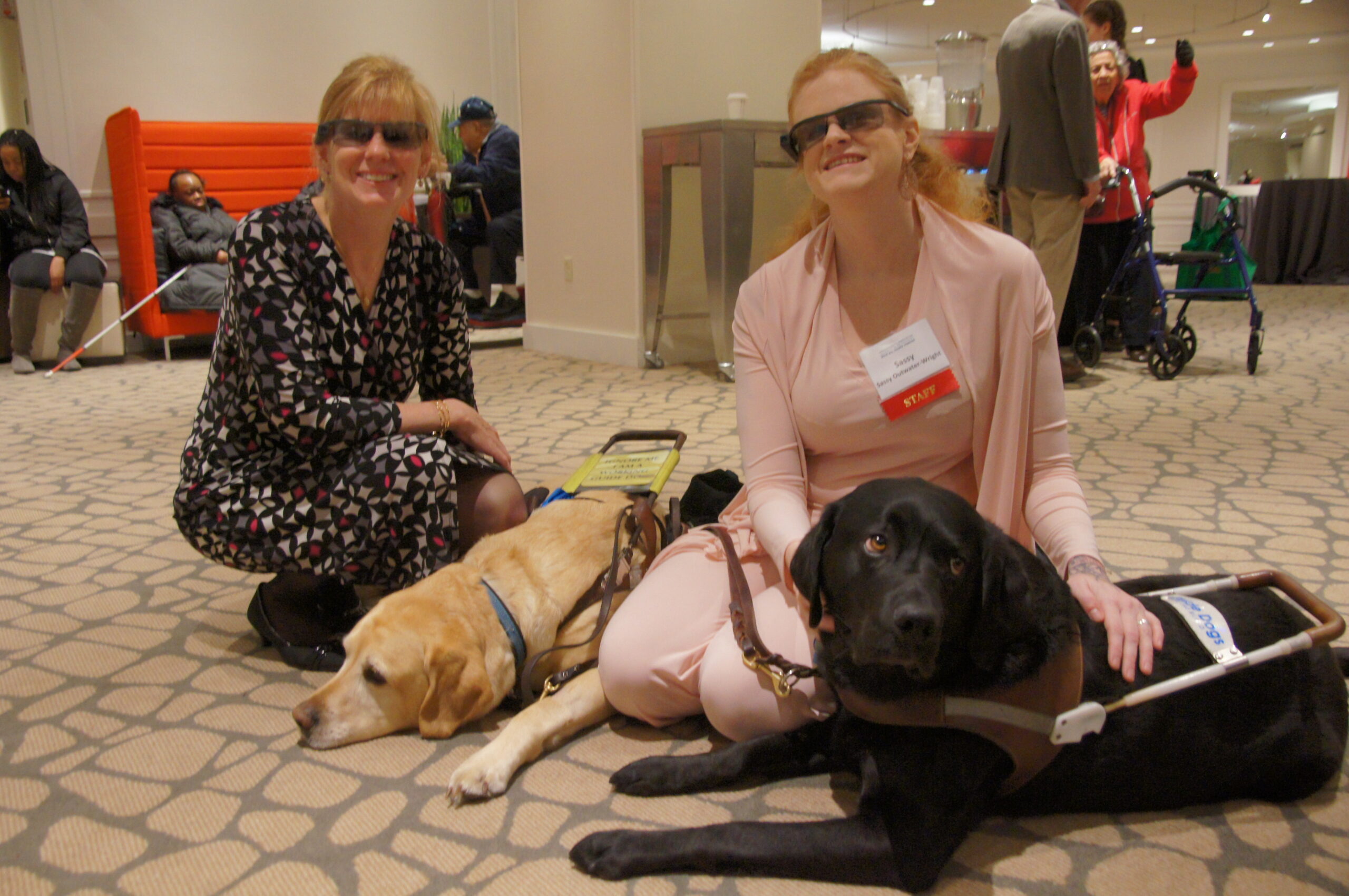 SONY DSC Sassy Outwater Wright with a Golden and Black Labrador Retriever.